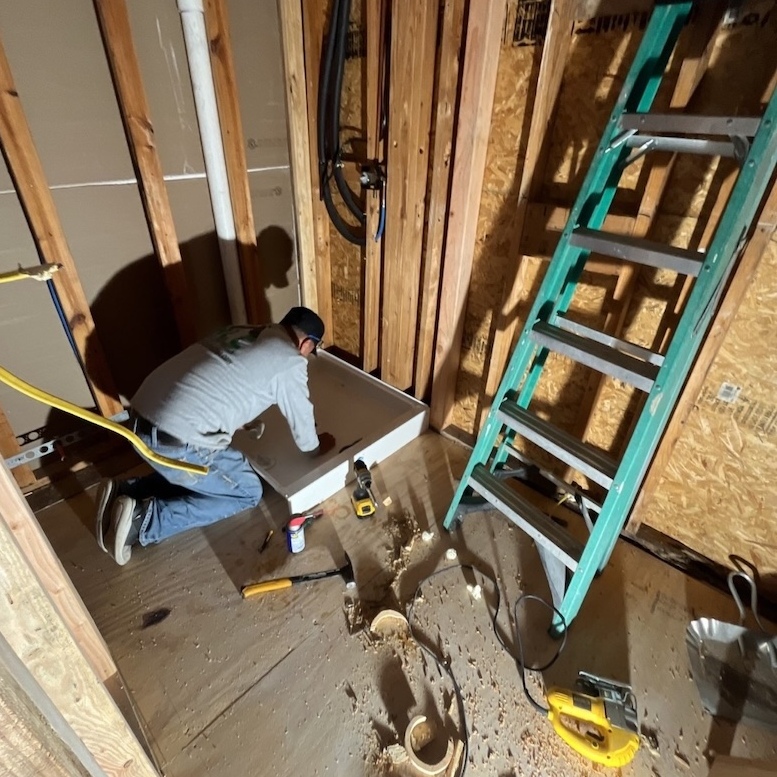 A worker is inputting service for a practical home remodel.